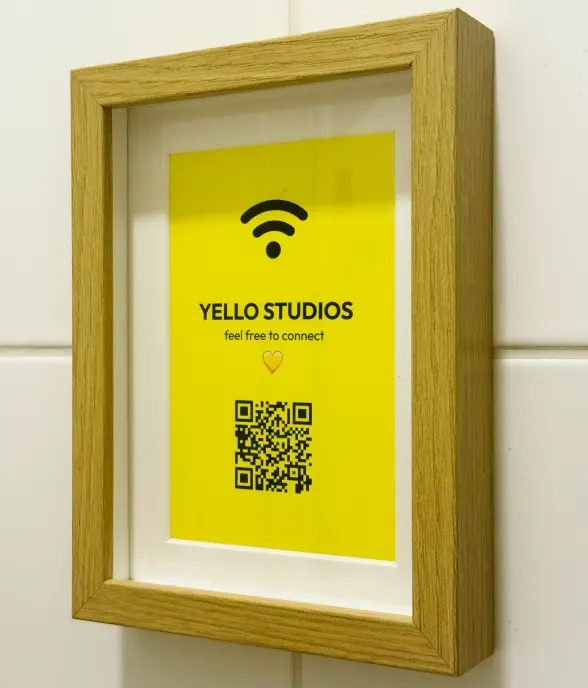 Picture frame on the wall with a QR code to connect to the wifi